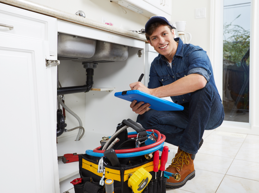 Licensed plumber documenting an under-sink plumbing inspection in a Murrieta home